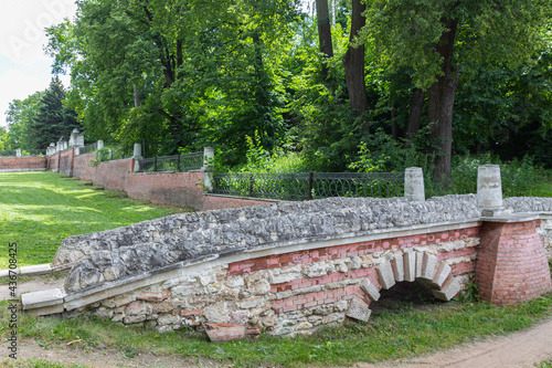 Old stone bridge in the park during summer