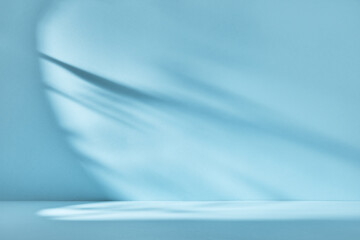 Abstract blue background with drop shadow and light. Backdrop for product presentation