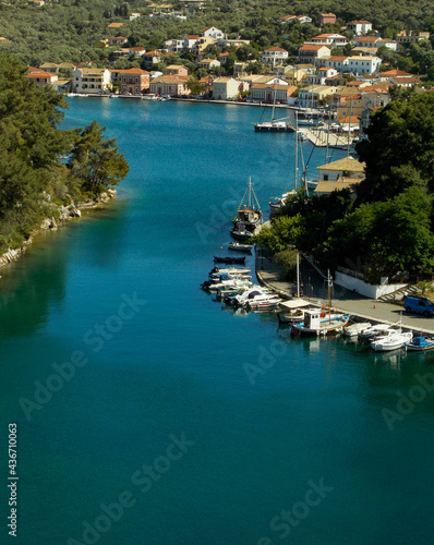 Yachts and boats in paxos harbour on the ionian greek island holiday resort. photo