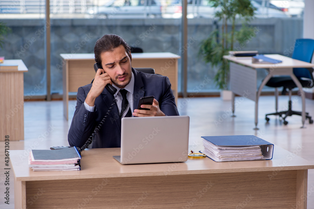 Young businessman employee working in the office Young businessman employee working in the office