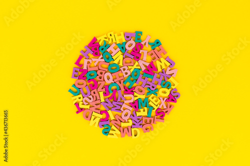 Flat lay top view letters on yellow background