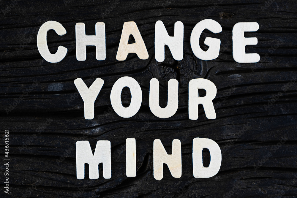 Change Your Mind words on dark wooden background. Business, motivational and inspirational concept.