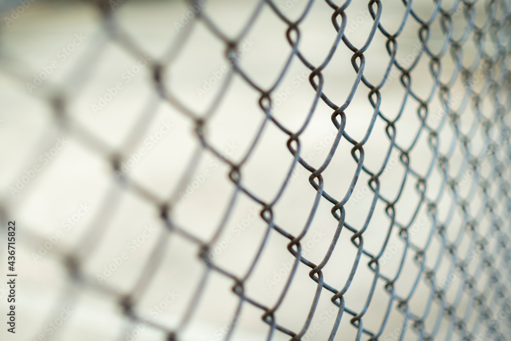 Fototapeta premium Close-up chain link fence , Sunset background