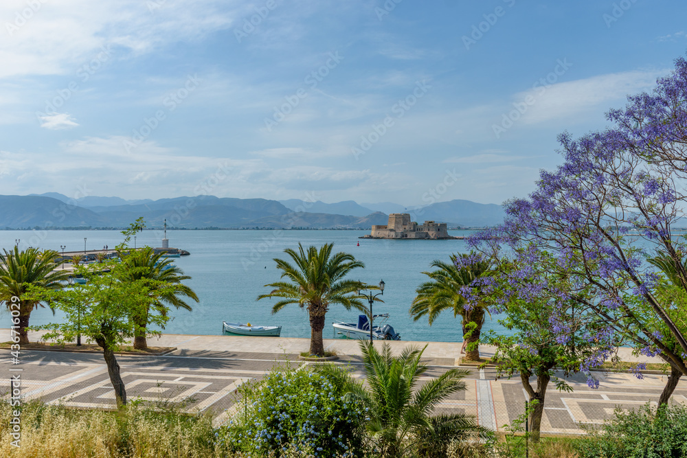 Spring view of the historical  Venetian water castle of Bourtzi located in  the old harbour of Nafplio Argolis Greece.