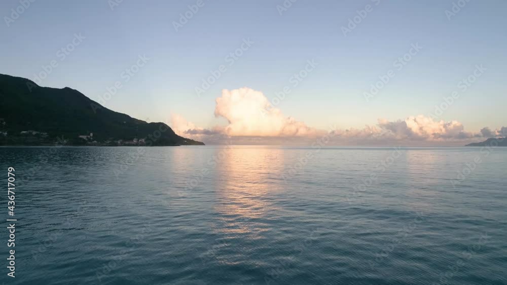 Drone video of Beau Vallon Beach, spectacular ocean views at sunset, Seychelles, Mahe Island, the drone flies low over the surface of the water. Drone video of Beau Vallon Beach, spectacular ocean views at sunset, Seychelles, Mahe Island, the drone flies low over the surface of the water.