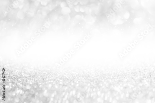 glitter vintage lights background. White, gray and silver. de-focused.used for display products and design.