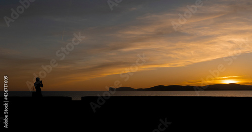 sunset with aperitif at the ramparts of the city of Alghero 