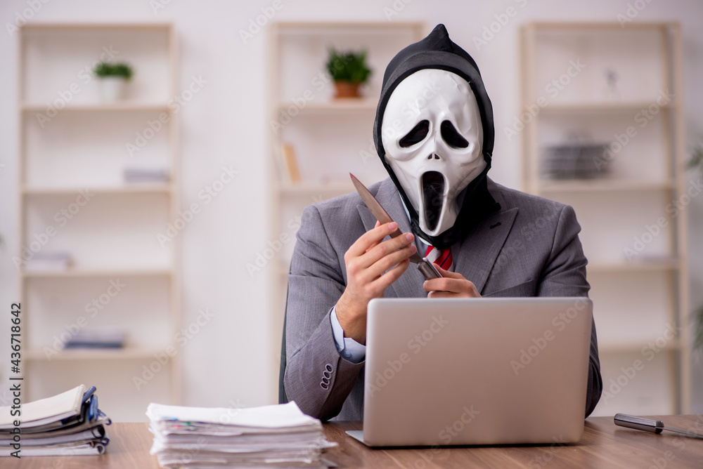 Devil businessman employee sitting at workplace Devil businessman employee sitting at workplace