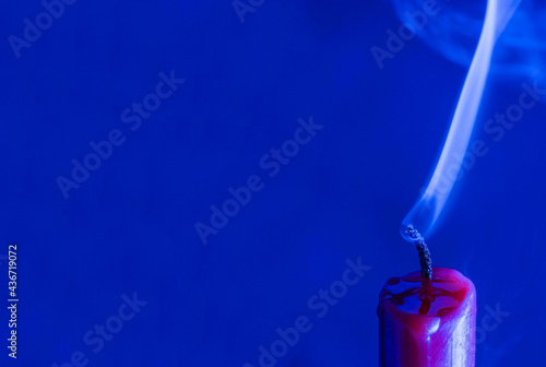 Candle with smoke and flame as a background 