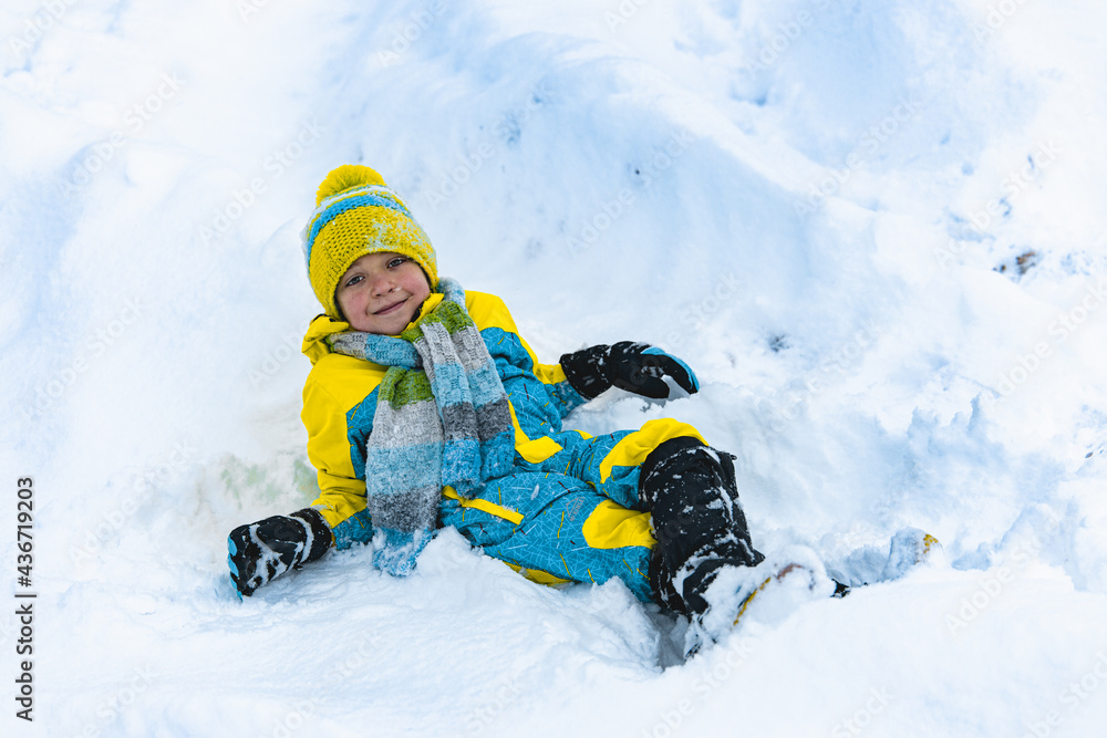 Child playing with snow in winter Child playing with snow in winter