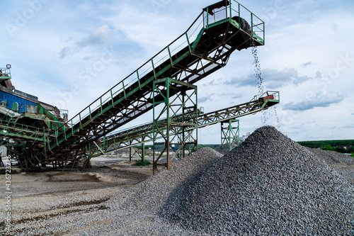 Photography Industrial background - crusher (rock stone crushing machine) at open pit mining