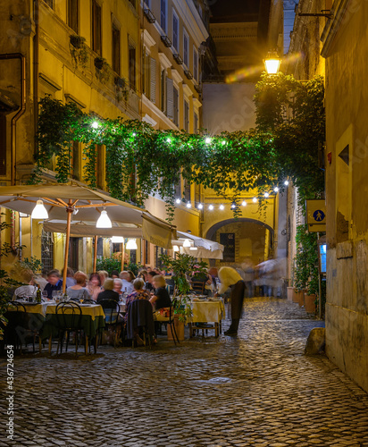 Night cozy old street in Trastevere in Rome, Italy. Trastevere is rione of Rome, on west bank of Tiber in Rome. 