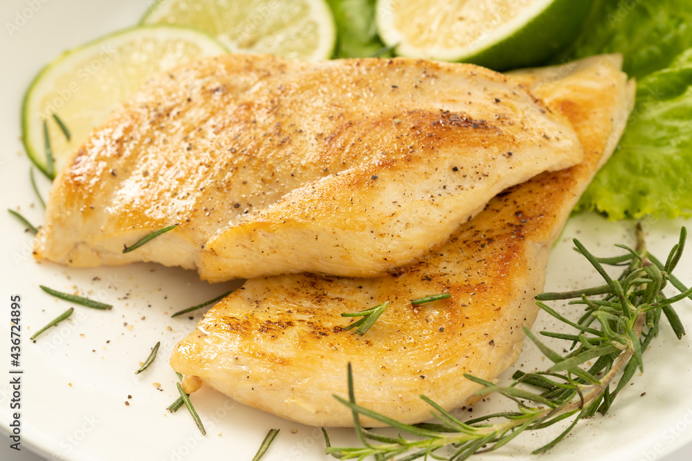 Pan-fried chicken breast on a solid background Pan-fried chicken breast on a solid background