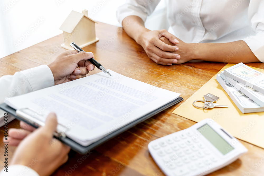 Property investment concept, image of small house model on the table. and home loan insurance. Property investment concept, image of small house model on the table. and home loan insurance.