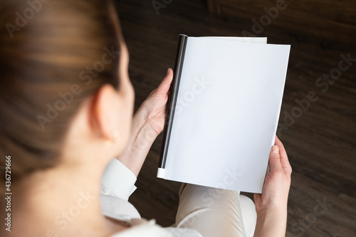 Female hands open blank catalog, magazines, book mock up