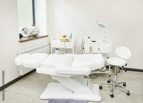 Interior of modern beauty room equipped with modern apparatus and medical equipments for skin treatment and beauty therapy in contemporary luxury spa clinic