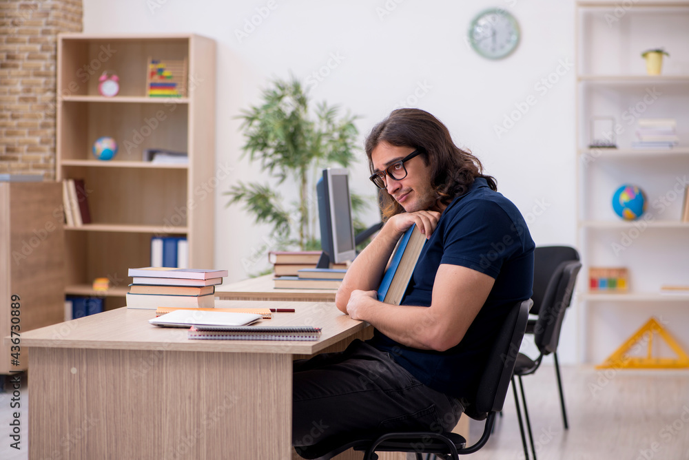 Young male student being tired during exam preparation Young male student being tired during exam preparation