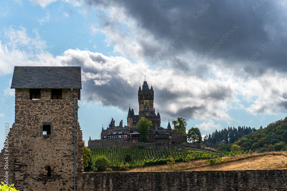 View on the castle in cochem surrounded by vineyards