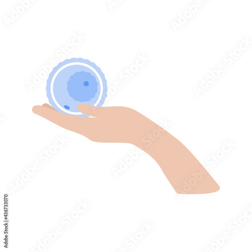 Egg donation. The hand holds the oocyte