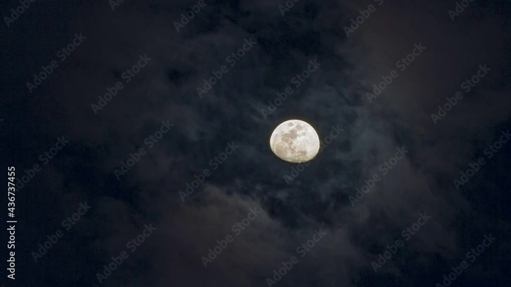 The moon through clouds at night The moon through clouds at night