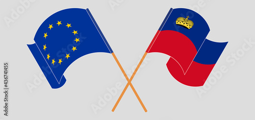 Crossed and waving flags of the EU and Liechtenstein