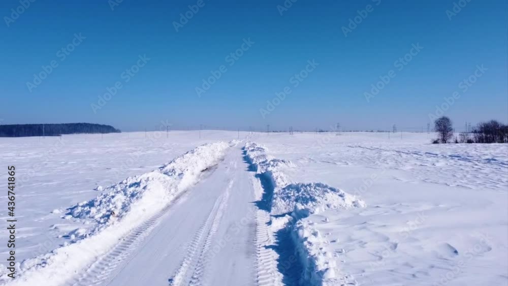 Smooth flight on a snowy winter empty road Smooth flight on a snowy winter empty road