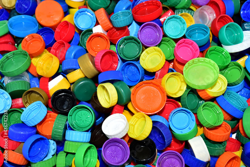 Plastic bottle caps for recycling. Cap material of plastic recyclable materials for recycling and reuse. Exchanging garbage for money. Reduse garbage and waste from polypropylene and polyethylene photo