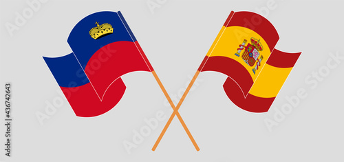 Crossed and waving flags of Liechtenstein and Spain