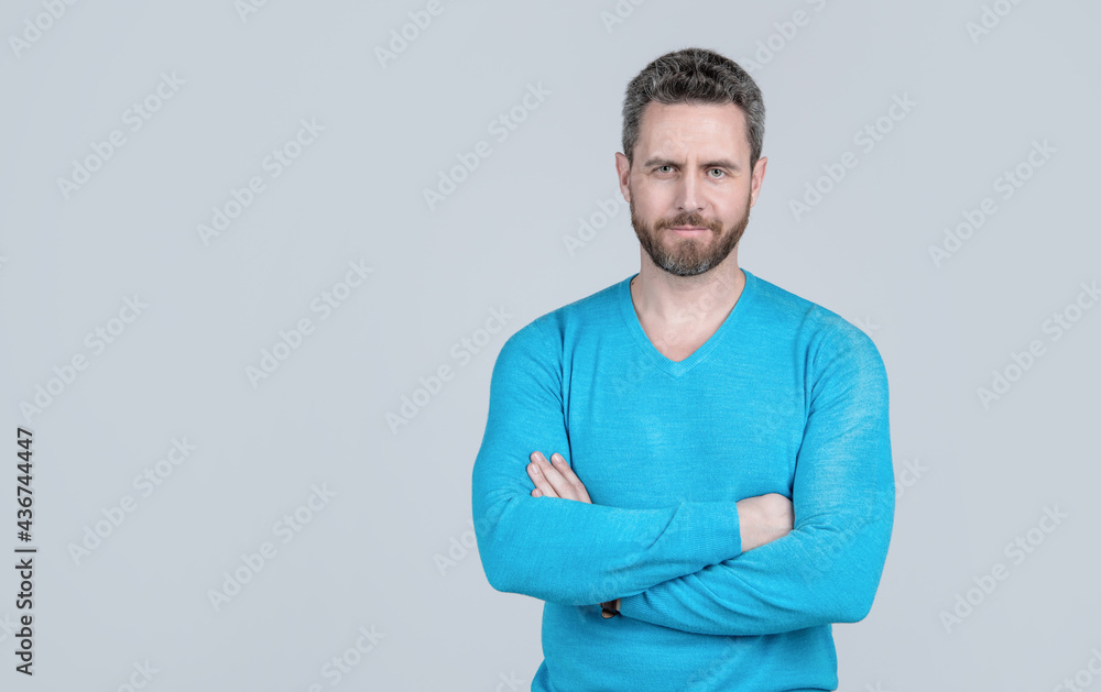 handsome man in casual wear has grizzled hair. successful man on grey background. handsome man in casual wear has grizzled hair. successful man on grey background.