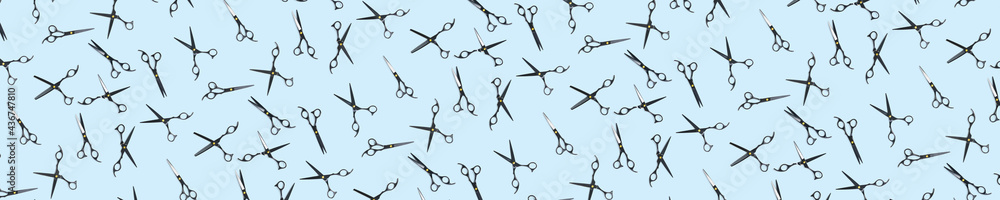 Background of black scissors. professional hairdresser black scissors isolated on blue. Black barber scissors, close up. pop art background, for prints or posters. not seamless pattern Background of black scissors. professional hairdresser black scissors isolated on blue. Black barber scissors, close up. pop art background, for prints or posters. not seamless pattern