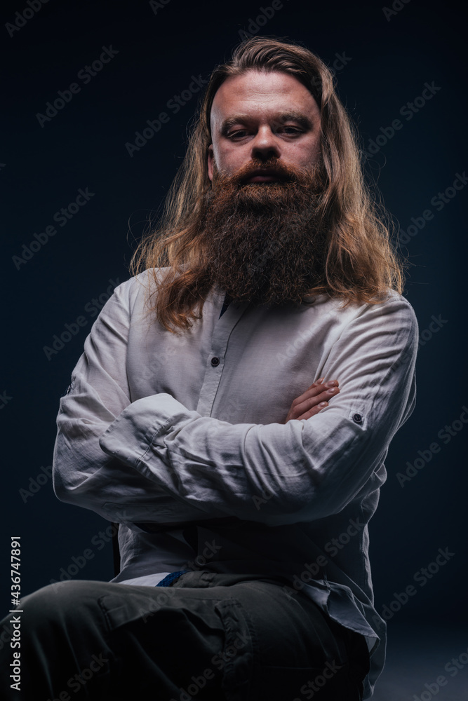 Close up portrait of handsome manly guy with beard posing in studio on a isolated background. Close up portrait of handsome manly guy with beard posing in studio on a isolated background.
