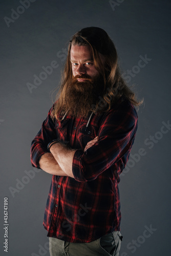 Beautiful strong nordic man with stylish hairstyle and beard on a isolated background.