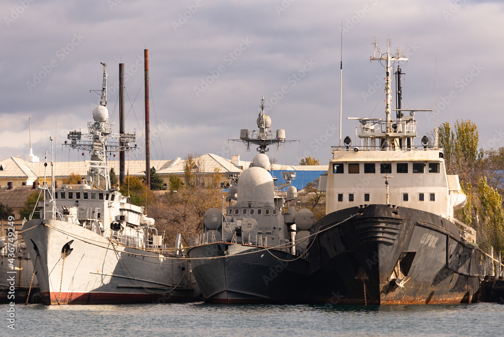 Sevastopol. Crimea. Winter 2021. Old decommissioned warships. Unmarked ships of various types are moored in the bay.