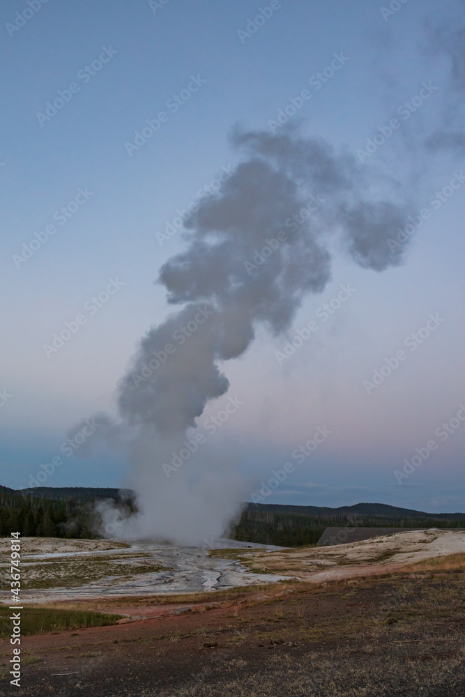 Old Faithful geyser eruption in Yellowstone National Park, Wyoming, USA