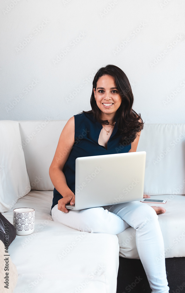 Young woman working from home using laptop and internet Young woman working from home using laptop and internet