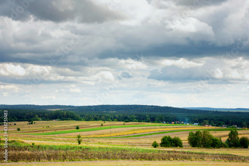 Summer landscape - agricultural fields after harvest in the countryside in eastern Poland