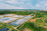 Aerial View Retention Basins, Wet Pond, Wet Detention Basin Or Stormwater Management Pond, Is An Artificial Pond With Vegetation Around The Perimeter, And Includes A Permanent Pool Of Water In Its