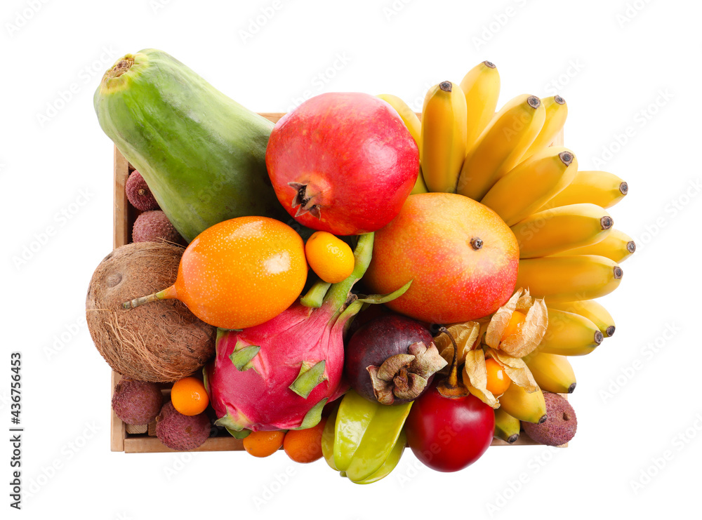 Crate with different exotic fruits on white background, top view