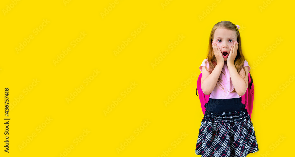 Back to school. A happy blonde girl elementary school student with a backpack is surprised and looks directly into the camera. Greeting card or banner for sale. copy space. mock up Back to school. A happy blonde girl elementary school student with a backpack is surprised and looks directly into the camera. Greeting card or banner for sale. copy space. mock up