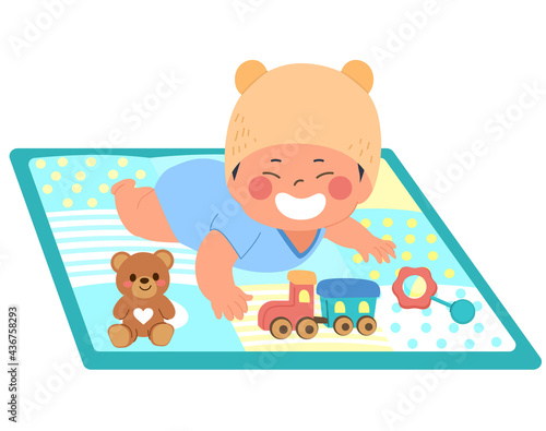 Cute asian baby wearing teddy hat playing on comfortable mat with toys