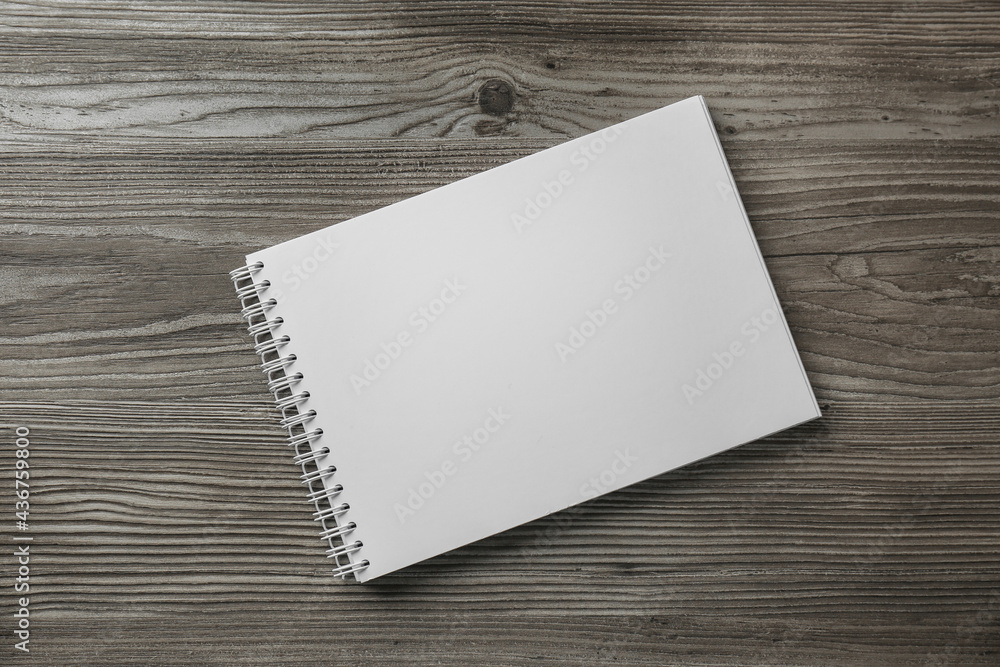 Blank paper brochure on wooden table, top view. Mockup for design Blank paper brochure on wooden table, top view. Mockup for design