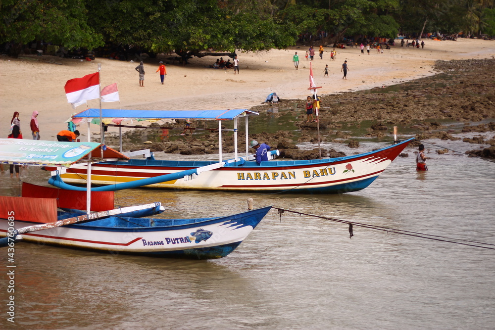 The view on the Trenggalek White Sand beach in the afternoon. The beach that presents the slow waves, gentle breeze, as if it always invites us to return there The view on the Trenggalek White Sand beach in the afternoon. The beach that presents the slow waves, gentle breeze, as if it always invites us to return there