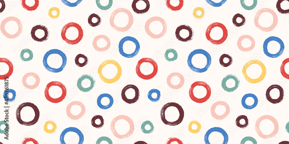 Colorful seamless pattern with rings in brush stroke technique. Vector abstract background with hand painted circles.