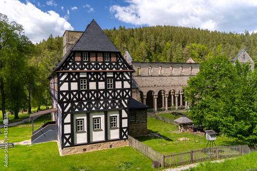 Das Amtshaus im thüringischen Paulinzella mit Klosterkirche im Hintergrund photo