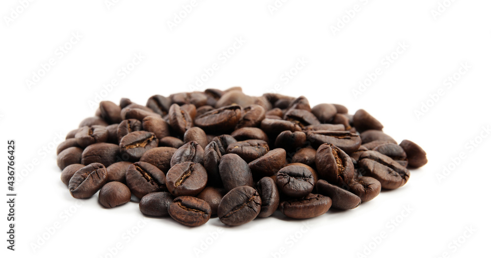 Heap of roasted coffee beans isolated on white Heap of roasted coffee beans isolated on white