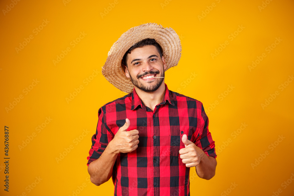 man dressed in junina party outfit with thumb up making ok sign - obrazy, fototapety, plakaty 