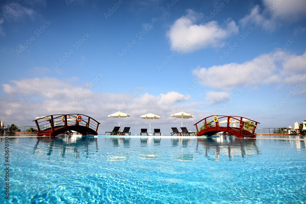 Beautiful landscape with blue sky and swimming pool at resort