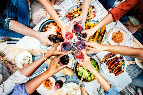 Friends doing a toast outdoors photo