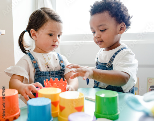 Принти на полотні Little kids playing toys at learning center