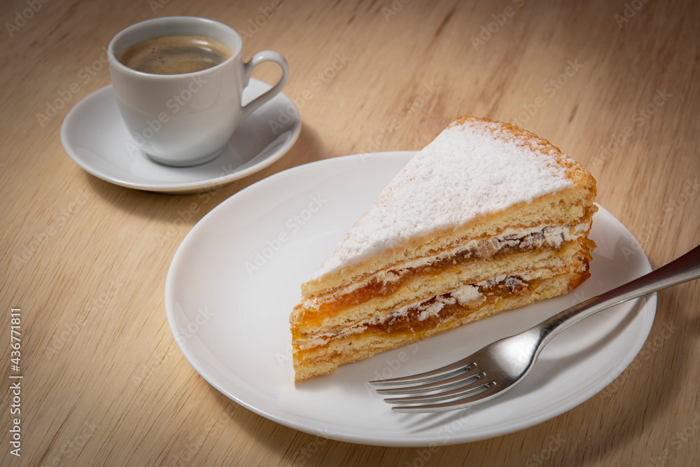 Delicious apricot cake with a cup of coffee Delicious apricot cake with a cup of coffee